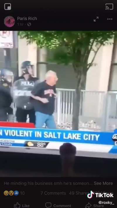 Shoving an old man with a cane.