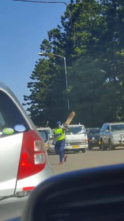 Police officer directing traffic&mdash;need this guy's enthusiasm