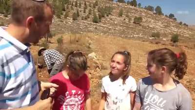 "Why else are we here?" "To show the Arabs who's boss!" Soft voiced colonist Rabbi showcases his brain washing of little kids into crimes against Palestinians.