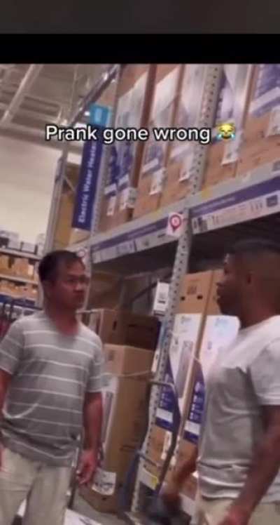 Dudes prank backfires; man gets heated after having large banner smacked onto him. Argument ensues.