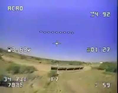 Sudanese Army FPV drone attacks RSF rebels Toyota pickup truck hiding under a bridge  