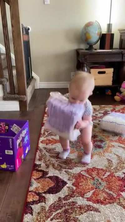 My unit of a 1 y/o yeeting a box of her big sister&rsquo;s pull-ups.