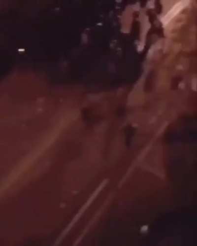 Iranian revolutionarie running over police forces.