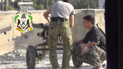 FSA recoilless rifle team hits a Syrian Army rooftop position made out of tires - Damascus -9/2/2013