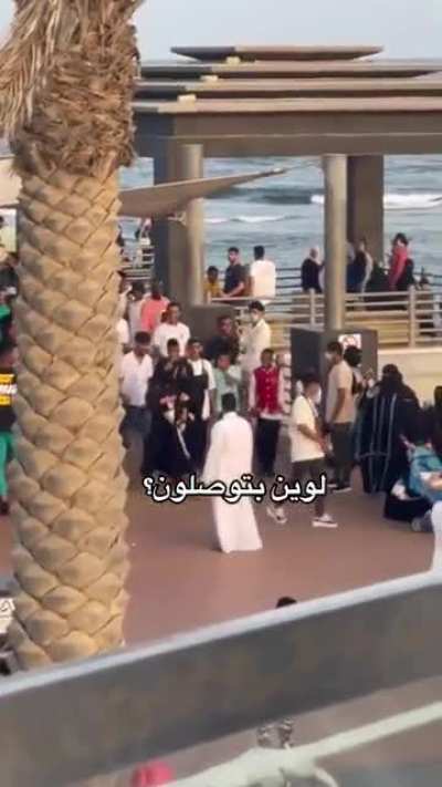 2 women surrounded by group of degenerates in Saudi Arabia