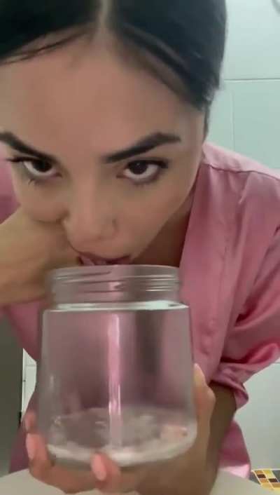 Girl Fingers Her Throat and Vomits Into A Jar