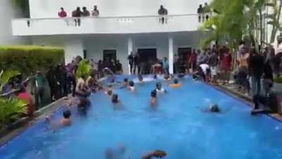 Sri Lankan protestors having a swim in the president&rsquo;s house