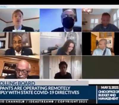 State official meeting team on Zoom while driving, debating a bill for harsher penalties for distracted driving