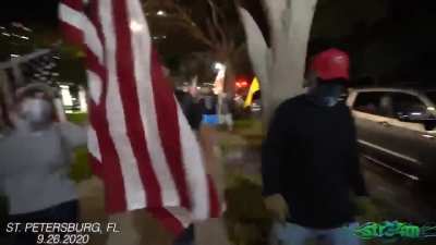 Trump supporters throw peaceful woman protestor headfirst into car then aim loaded gun at de-escalators