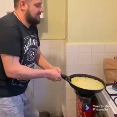 Making his omelette for the first time