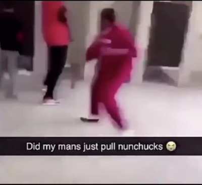 Guy pulls out nunchucks during fight