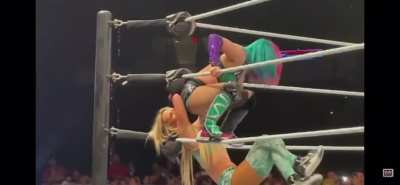 Carmella takes a Stinkface from Asuka