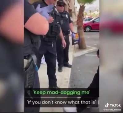 Police officer &ldquo;detains" guy after getting in his face
