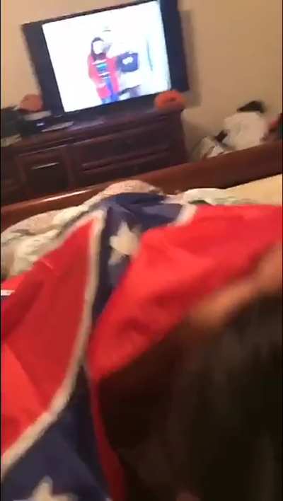 Sucking a black dick wrapped in a confederate flag