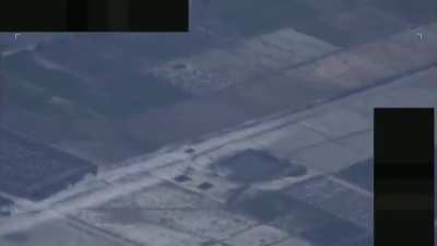 An F-16 fighter jet doing a high-speed low pass over a car as a "show of force."
