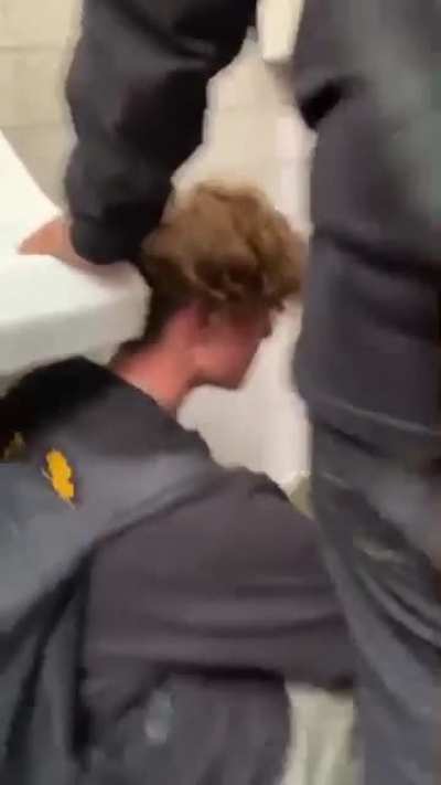 Tall guy was spraying water in peoples face. Currently in hospital I believe.