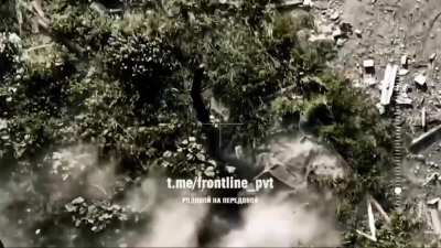 Russian FPV drone drops an explosive on a Ukrainian soldier