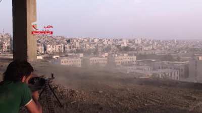 FSA fighter targeting distant SAA controlled buildings with a PKM - Aleppo - 8/28/2014