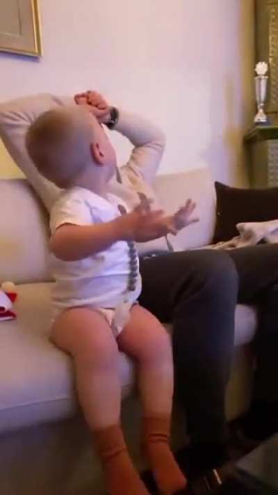 Watching the game with dad.