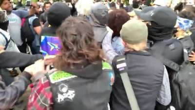 Mob of CHAZ residents call black man a "race traitor" for carrying the American flag