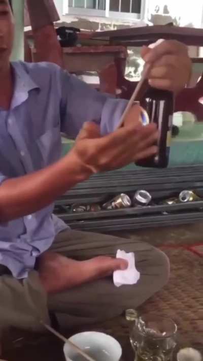 Opening a bottel with pointed stick