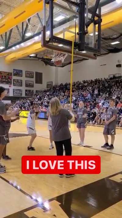 Crowd goes in to silent mode to let jules hoogland listen sound to attempt basket. And goes bonkers after she hit it.