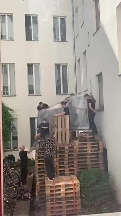 How does one get a piano into a room on the second floor of a house?