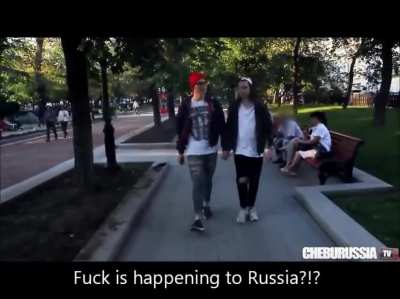 Two guys walk through Moscow holding hands. You can imagine how this goes