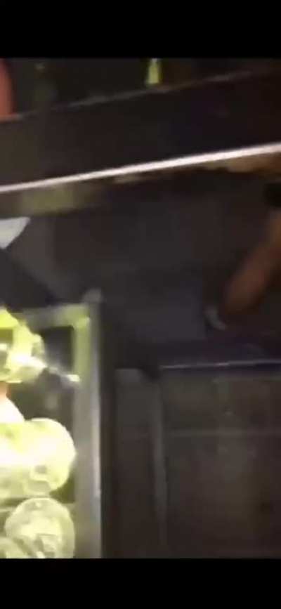 Woman pisses into a glass