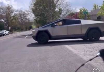 Cybertruck driver rages at kids on bikes, calls them homophobic slurs, threatens to rip off their heads and spit down their throats; suggests the kids are just mad at Elon Musk