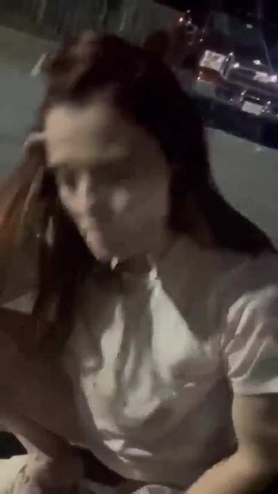 Young White Girl submissive against a car in public