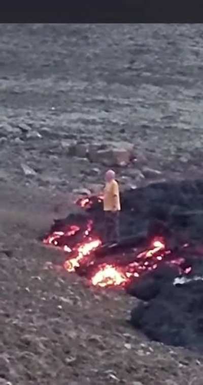 Standing on fresh lava for a photo..