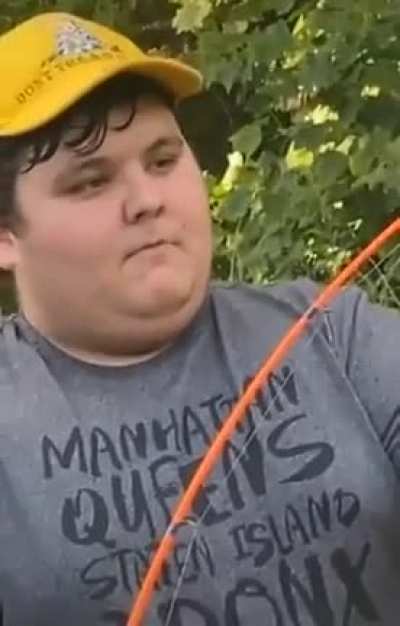 Guy showing off his fishing rod