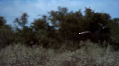 A WWII tank shell flying through the air