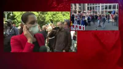 Reporter gets surrounded by angry mob of covid deniers