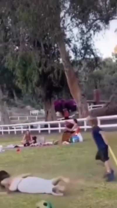 Kid Getting In the Way Of Woman Playing Soccer
