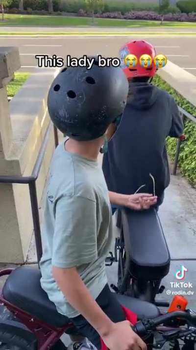 Furious woman berates kids on bikes