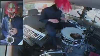 Clowns playing metal jazz in a mini van