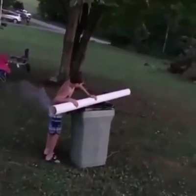 Kid shoots firework to light a bonfire