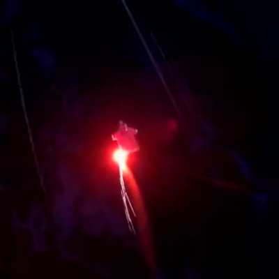 At night with a flare in the snow