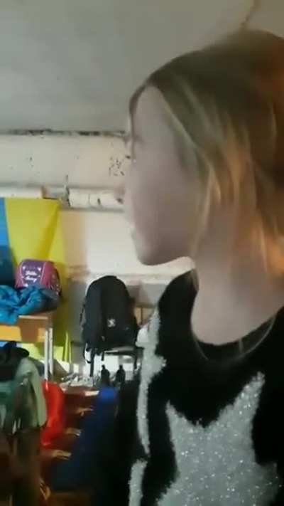 Ukraine Girl Sings "Let it go" to help calm others in a bomb shelter