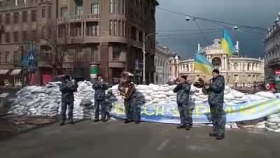 Ukrainian military band plays 'Don't Worry Be Happy' in anticipation of Russian attack in Odessa.
