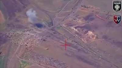 Drone footage of a Ukrainian M142 HIMARS strike on a Russian training ground using M30A1 rockets. Zaporizhzhia Oblast.