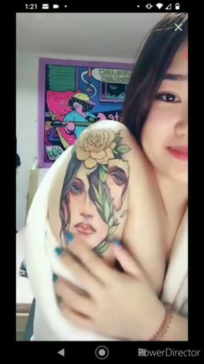 Showing off her tattoo