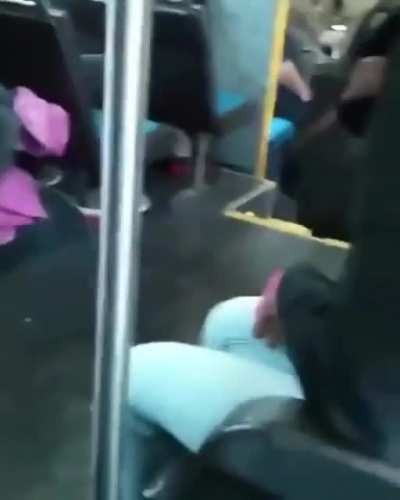 woman throws baby in bus at random stranger to fight another woman