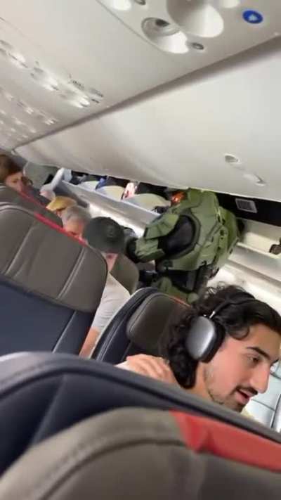 You go to fly somewhere and this guy sits next to you