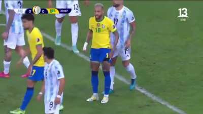 Otamendi "helping" Neymar get up.