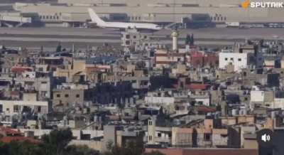 Video showing a building getting airstriked by the IDF in beirut next to the airport right as a plane is getting ready to take off