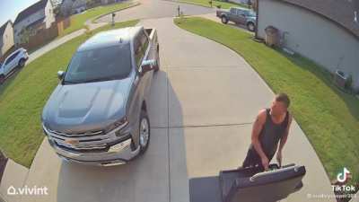 Sales woman runs to a man in fear of a friendly dog