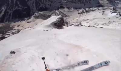 Skier snags a rock trying to ski down a 1000 ft slope in Aspen, CO 